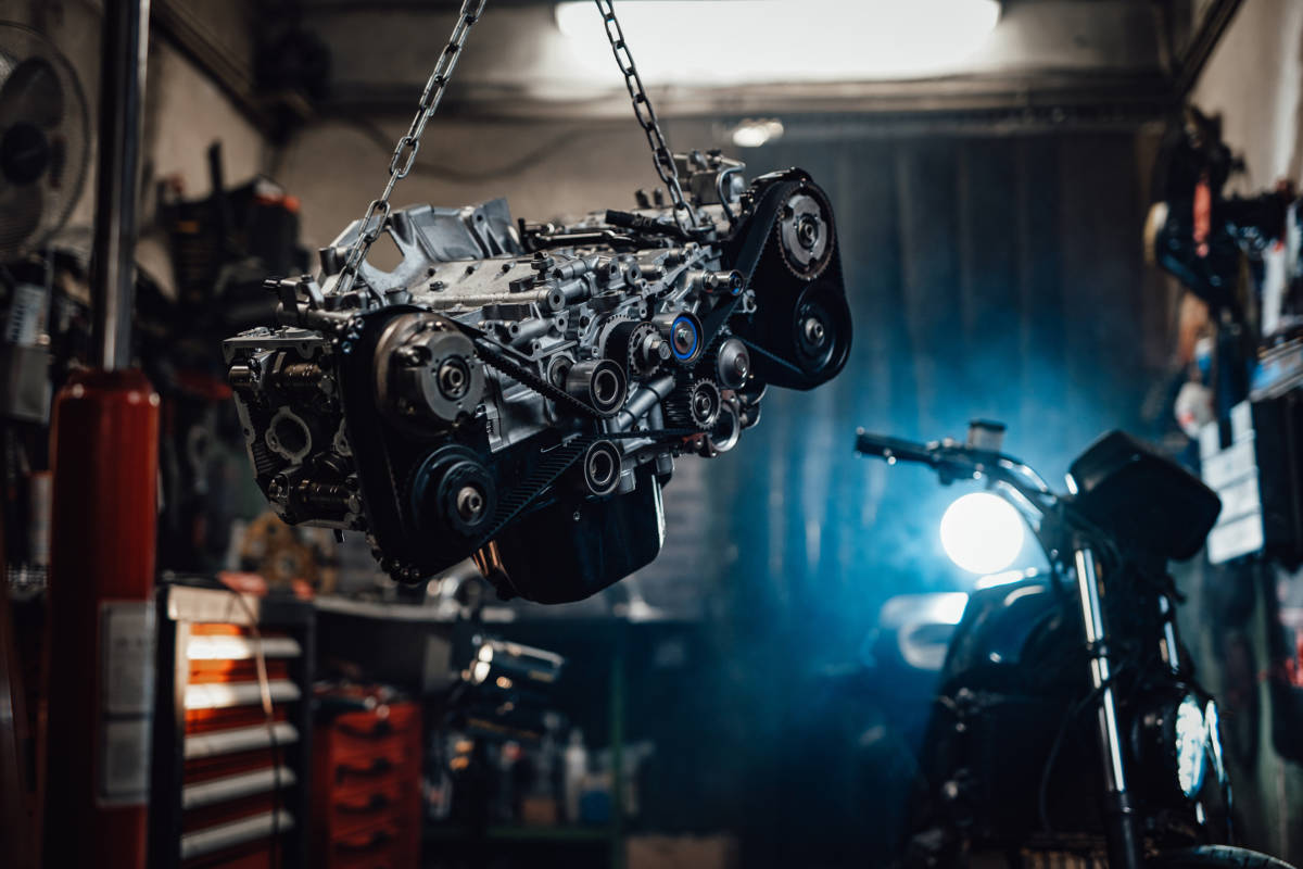 Suspended boxer engine in a dark garage or workshop